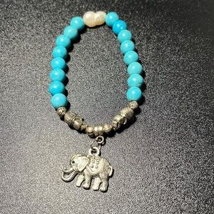 3/$25. 6” turquoise and pearl elastic bracelet with silver elephant